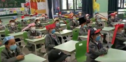 杭州小学生戴一米帽上课原因是什么 详细经过现场图太可爱了
